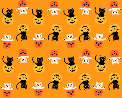 Black and white Halloween cats with pumpkins on bright orange cheddar cotton quilting fabric from Boo Valley by Ruby Star Society's Alexia Abegg.