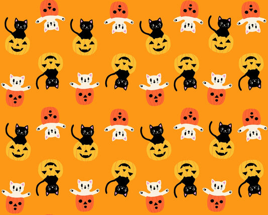 Black and white Halloween cats with pumpkins on bright orange cheddar cotton quilting fabric from Boo Valley by Ruby Star Society's Alexia Abegg.