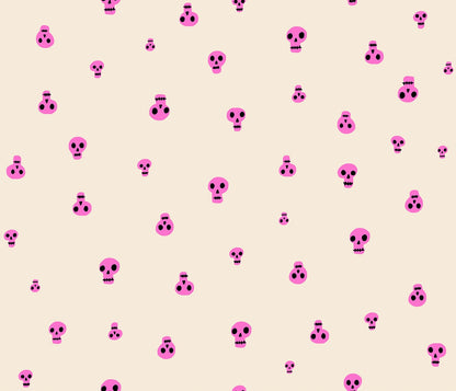 Neon pink scattered skulls with black details on cream Halloween cotton quilting fabric. Boo Valley by Ruby Star Society's Alexia Abegg.