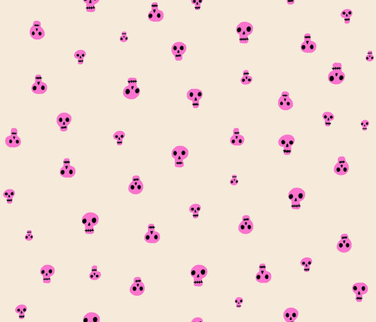 Neon pink scattered skulls with black details on cream Halloween cotton quilting fabric. Boo Valley by Ruby Star Society's Alexia Abegg.