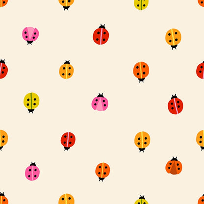 Colorful nursery ladybugs in red, orange, pink, and yellow on natural cotton quilting fabric. Daisy Days by Ruby Star Society's Alexia Abegg.