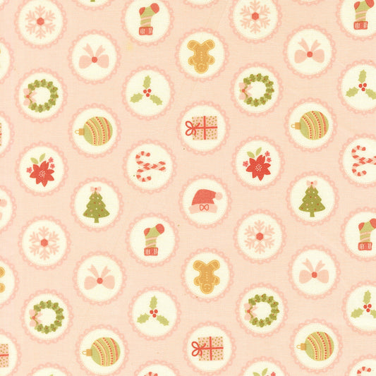 Christmas motifs on blush pink December Darling by My Sew Quilty Life cotton quilting fabric. Features snowflakes, gingerbread men, and Santa hats.
