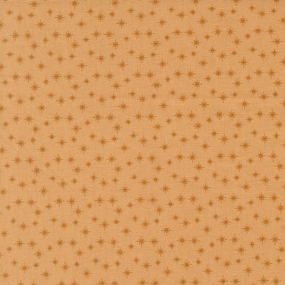 Moda's small cookie stars December Darling by My Sew Quilty Life cotton quilting fabric with scattered dark tan stars on light brown.