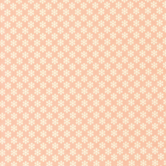 Moda's December Darling by My Sew Quilty Life cotton quilting fabric with scattered cream snowflakes and stars on cotton candy pink for winter.