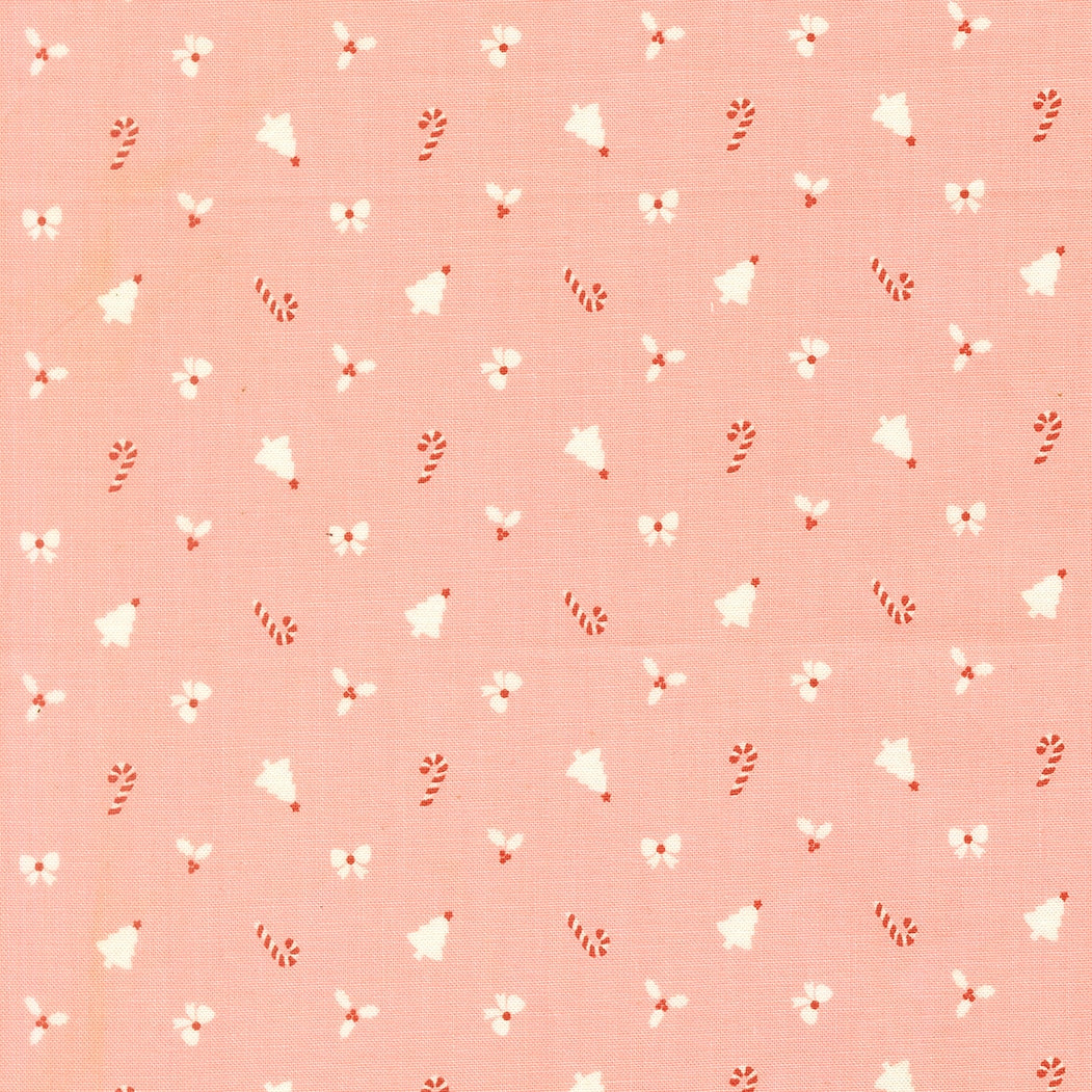 Christmas novelties on cotton candy pink December Darling by My Sew Quilty Life cotton quilting fabric, bells, candy canes, bows, holly sprigs.