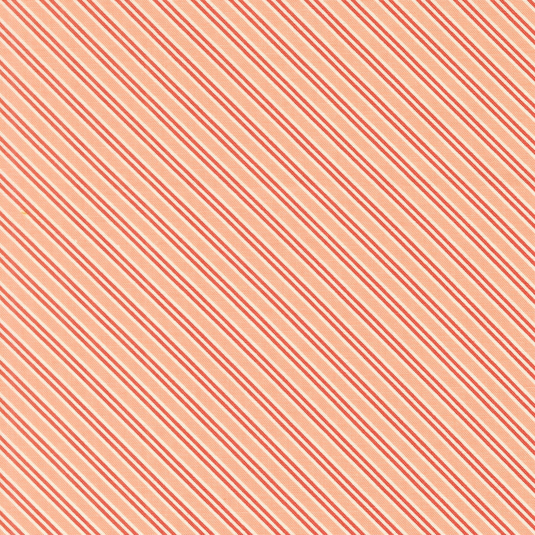 Moda's December Darling by My Sew Quilty Life cotton quilting fabric features cotton candy peach and coral red diagonal stripes with thin white accents.
