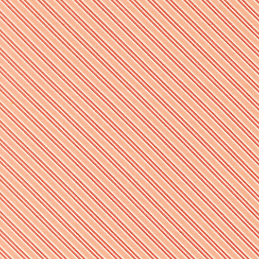 Moda's December Darling by My Sew Quilty Life cotton quilting fabric features cotton candy peach and coral red diagonal stripes with thin white accents.