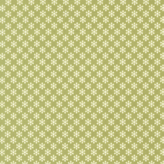 December Darling Christmas snowflakes on sage green cotton quilting fabric by My Sew Quilty Life. Features small, stylized ivory snowflakes in a geometric pattern.