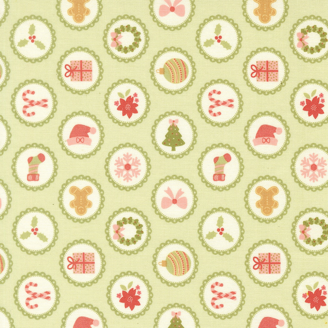 Christmas motifs on leaf green December Darling by My Sew Quilty Life cotton quilting fabric, with gingerbread men, candy canes, and Santa hats.
