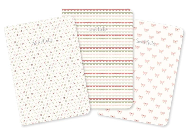 Moda's low volume cross stitches on cream quilting fabric from December Darling by Briggs, Heather, featuring muted rose, sage green, and light taupe crosses.