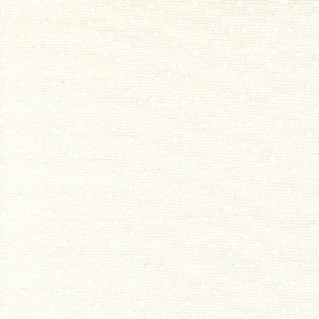 Moda's light cream cotton quilting fabric with tiny white scattered stars. December Darling by My Sew Quilty Life.