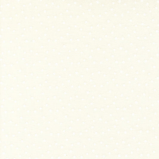 Moda's light cream cotton quilting fabric with tiny white scattered stars. December Darling by My Sew Quilty Life.