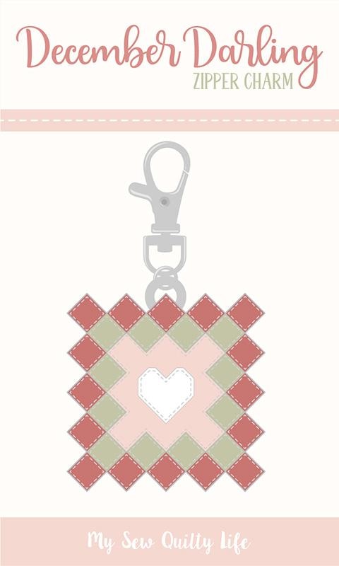 Moda's December Darling by Briggs, Heather quilting fabric features a Christmas granny square with a heart design in brick red, sage green, and pale pink on cream.