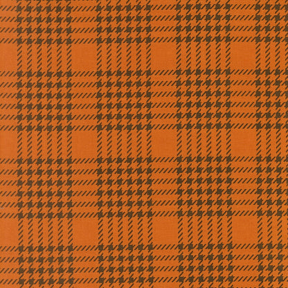 Pumpkin orange houndstooth check cotton quilting fabric. Gothic Haunt by Stacy Iest Hsu. Dark brown shapes, autumn theme.