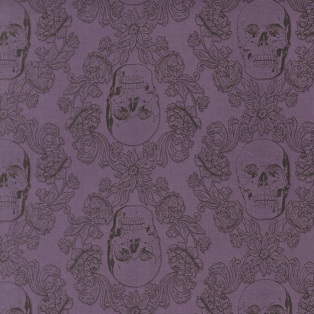 Moda's purple skull damask Gothic Haunt by Stacy Iest Hsu cotton quilting fabric for Halloween. Features flowers, leaves, and skulls in plum on purple haze.