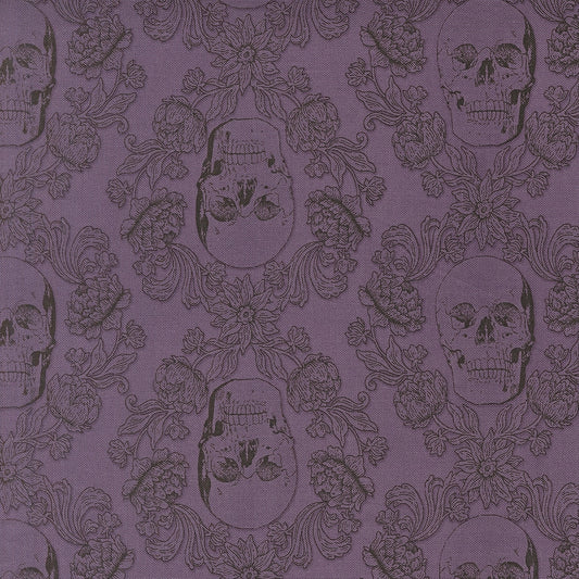Moda's purple skull damask Gothic Haunt by Stacy Iest Hsu cotton quilting fabric for Halloween. Features flowers, leaves, and skulls in plum on purple haze.