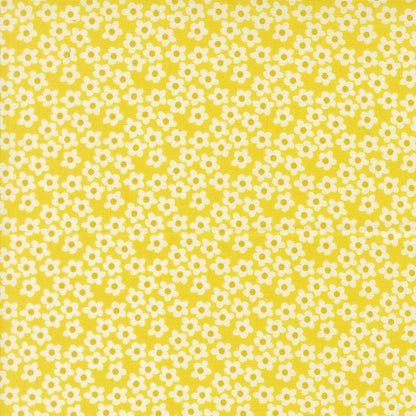 Moda's tiny white flowers with yellow centers on bright yellow Popcorn by Elizabeth Hartman cotton quilting fabric for spring and summer.