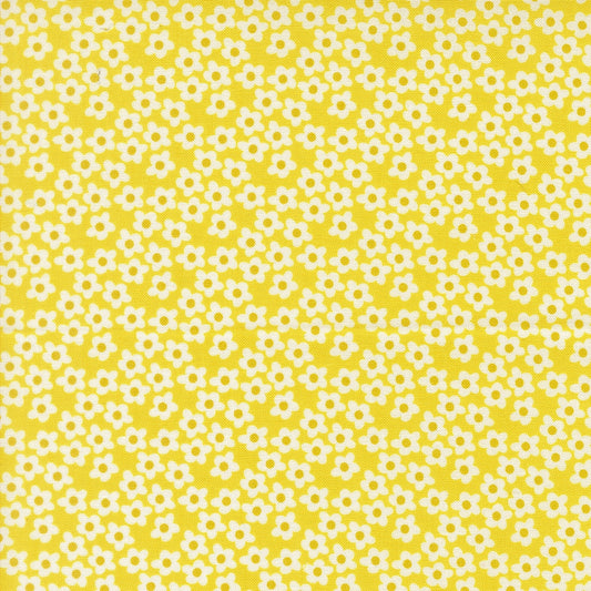 Moda's tiny white flowers with yellow centers on bright yellow Popcorn by Elizabeth Hartman cotton quilting fabric for spring and summer.