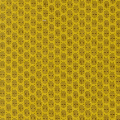 Moda's citrine bug print cotton quilting fabric from Popcorn by Elizabeth Hartman, featuring small olive brown ladybugs on bright citrine yellow.