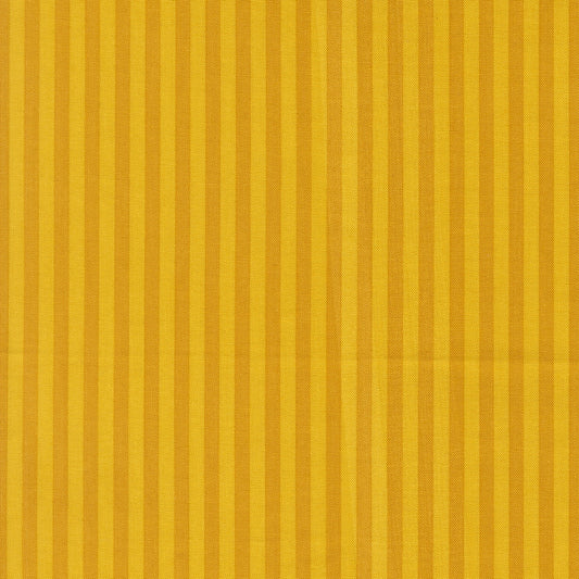 Moda's golden vertical stripes, alternating with deep golden hues, on Popcorn by Elizabeth Hartman cotton quilting fabric.