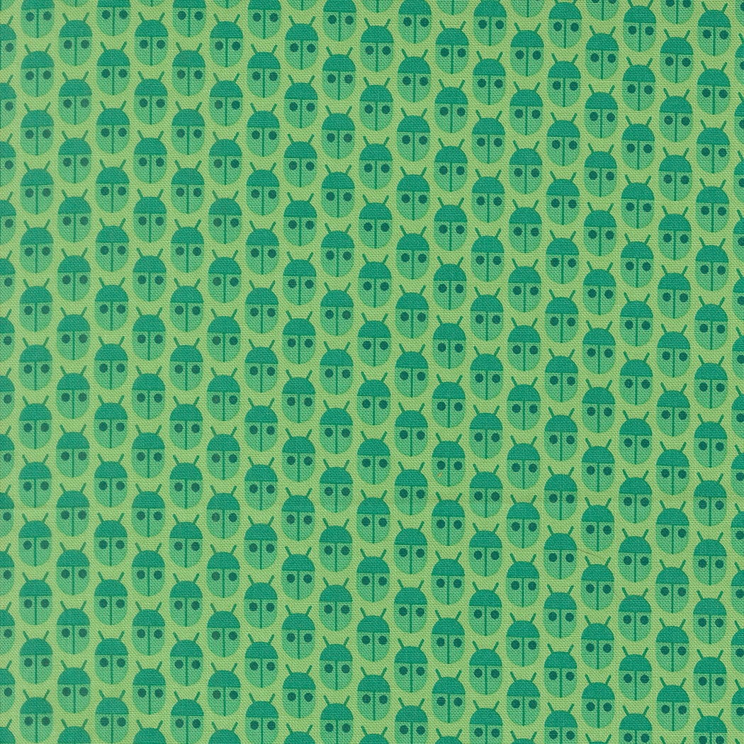 Moda's Popcorn by Elizabeth Hartman cotton quilting fabric with small, stylized jade green beetles and charcoal eyes on a light mint background.