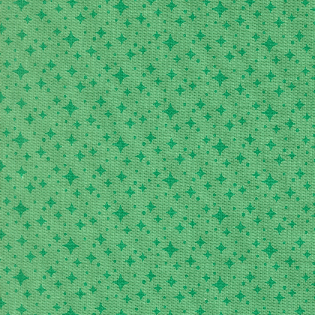 Moda's jade green stars blender Popcorn by Elizabeth Hartman cotton quilting fabric with celestial themed small stars and dots in emerald green.