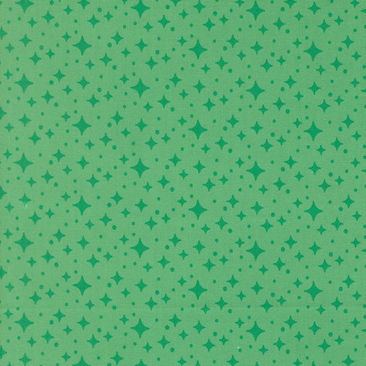 Moda's jade green stars blender Popcorn by Elizabeth Hartman cotton quilting fabric with celestial themed small stars and dots in emerald green.