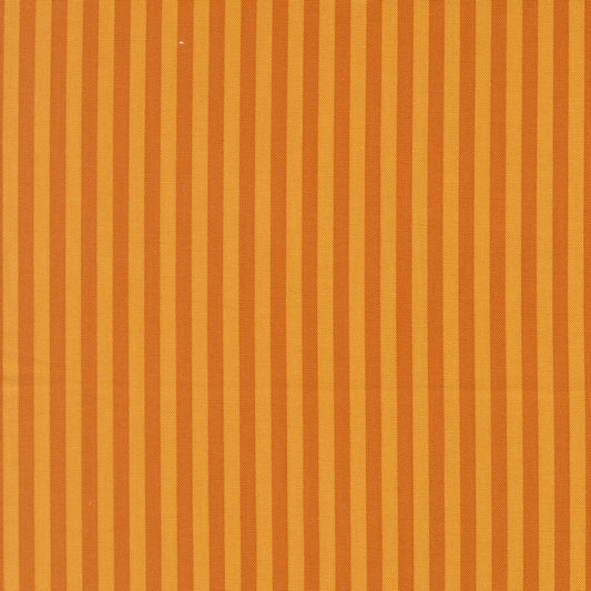 Moda's evenly spaced vertical stripes alternating between warm longhorn orange and darker burnt orange Popcorn by Elizabeth Hartman cotton quilting fabric.