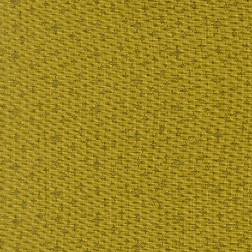 Moda's pesto green stars blender, Popcorn by Elizabeth Hartman cotton quilting fabric, featuring small dark olive green stars and dots.