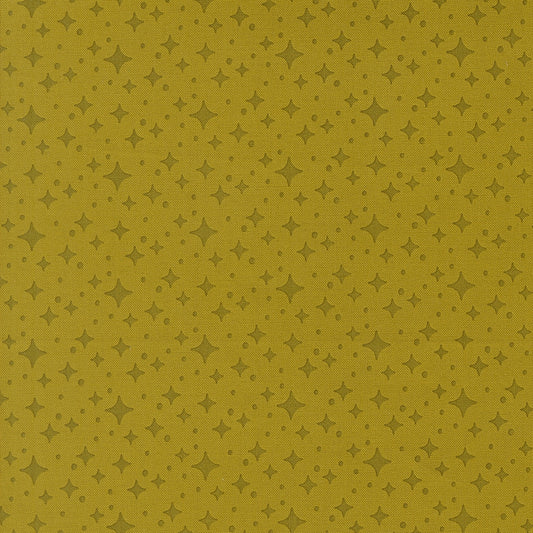 Moda's pesto green stars blender, Popcorn by Elizabeth Hartman cotton quilting fabric, featuring small dark olive green stars and dots.