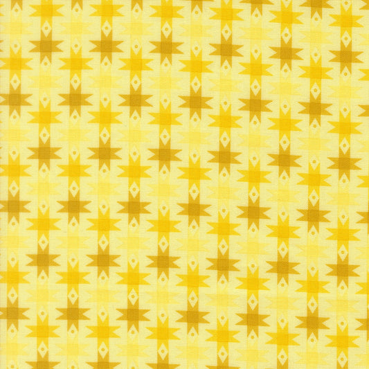Moda's Popcorn by Elizabeth Hartman cotton quilting fabric with sunshine yellow and mustard gold geometric stars on pale yellow.