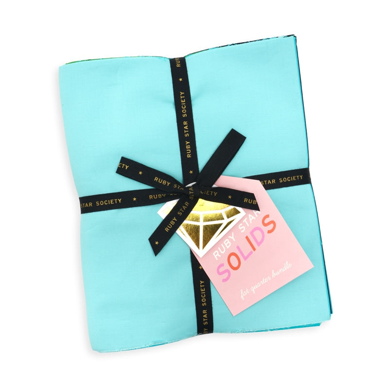 Moda's Ruby Star Solids Fat Quarter Bundle by Ruby Star Society's Ruby Star Society. 40 fat quarters of cotton quilting fabric, 18 in x 21 in.