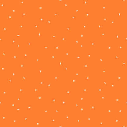 Moda's bright orange cotton quilting fabric from Sidekicks by Ruby Star Society's Ruby Star Society features small white asterisks scattered allover.