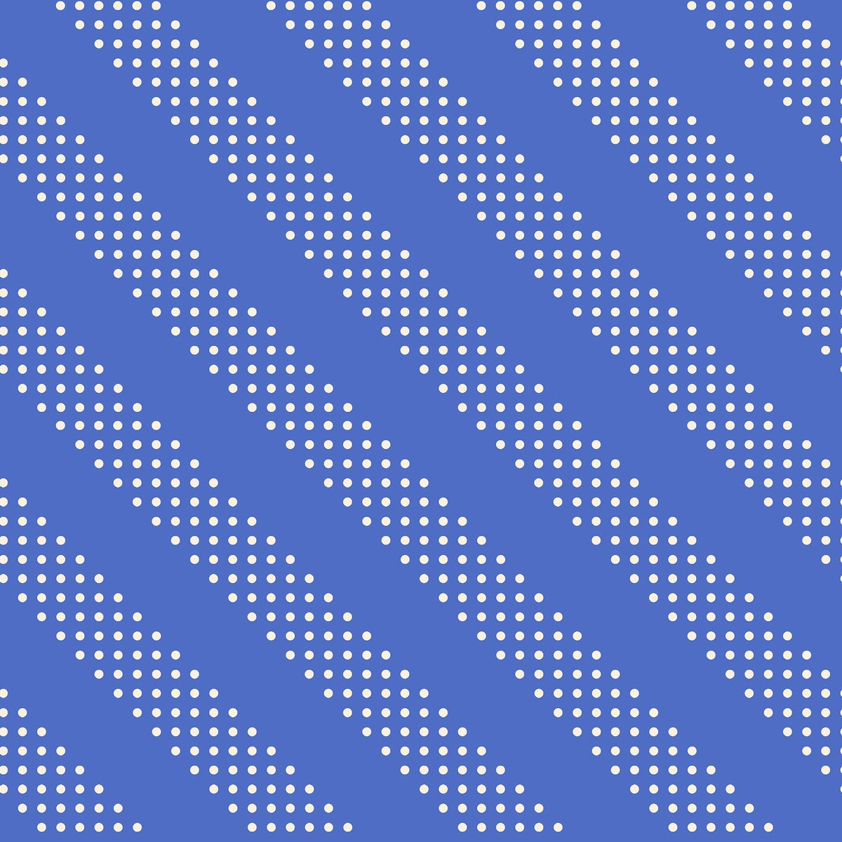 Royal blue dotted diagonal stripes cotton quilting fabric. Moda's Sidekicks by Ruby Star Society's Ruby Star Society, with small white polka dots.