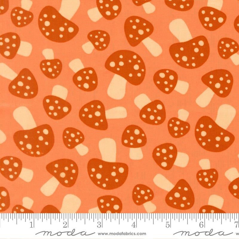 Whimsical woodland mushrooms, dark rust caps, cream spots on coral Toast and Jam cotton quilting fabric by Elizabeth Hartman.