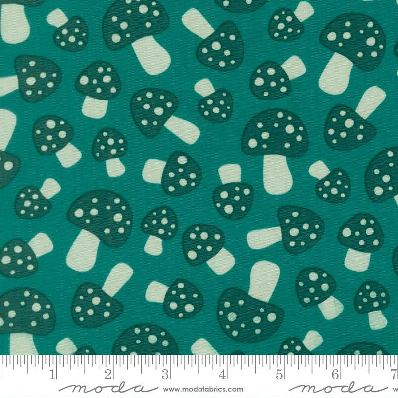 Moda's Toast and Jam by Elizabeth Hartman cotton quilting fabric, featuring dark teal mushrooms with scattered spots on a deep teal background.