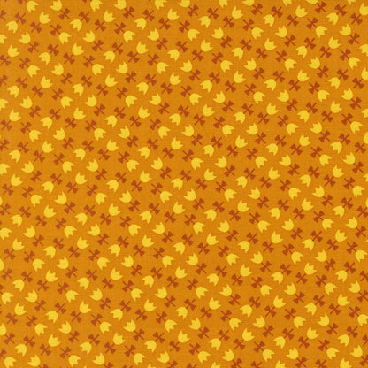 Autumnal tulips on chai cotton quilting fabric from Moda's Toast and Jam by Elizabeth Hartman, with small yellow tulips and rust bows on orange background.