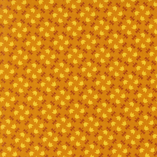 Autumnal tulips on chai cotton quilting fabric from Moda's Toast and Jam by Elizabeth Hartman, with small yellow tulips and rust bows on orange background.