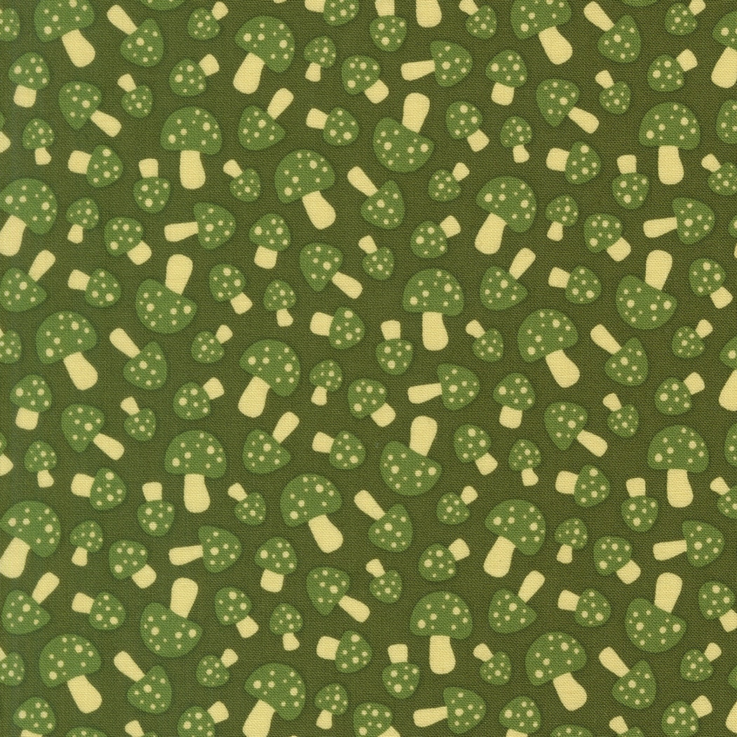Green spotted mushrooms scattered across dark green cotton quilting fabric. Toast and Jam by Elizabeth Hartman. Woodland theme.