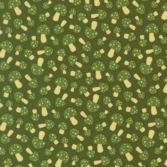 Green spotted mushrooms scattered across dark green cotton quilting fabric. Toast and Jam by Elizabeth Hartman. Woodland theme.