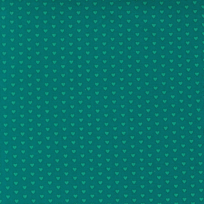 Moda's lagoon small hearts Toast and Jam by Elizabeth Hartman cotton quilting fabric, with small aqua hearts patterned on a deep lagoon background.
