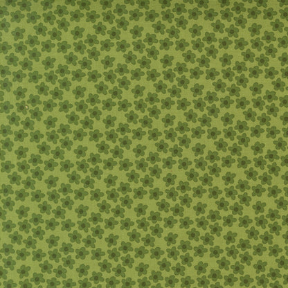 Green small flowers Toast and Jam by Elizabeth Hartman cotton quilting fabric. Small stylized five-petaled flowers with darker olive centers on sage green.