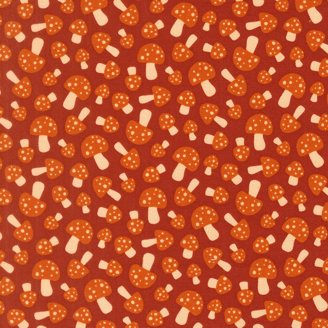 Rust mushrooms cotton quilting fabric, Toast and Jam by Elizabeth Hartman. Small orange spotted mushrooms on deep rust.