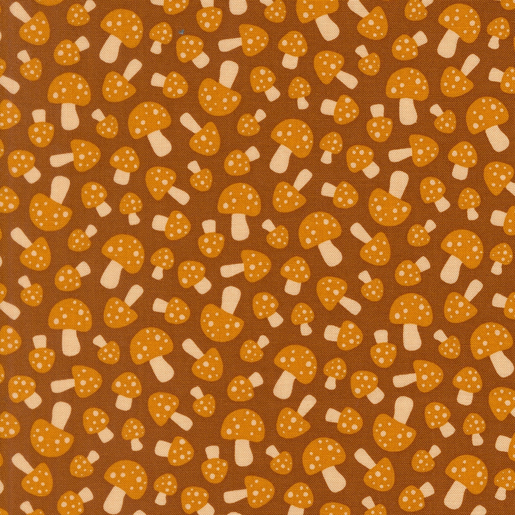 Moda's sepia mushrooms on brown woodland Toast and Jam by Elizabeth Hartman cotton quilting fabric, with orange dotted caps and ivory stems.