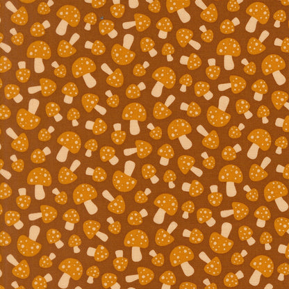 Moda's sepia mushrooms on brown woodland Toast and Jam by Elizabeth Hartman cotton quilting fabric, with orange dotted caps and ivory stems.
