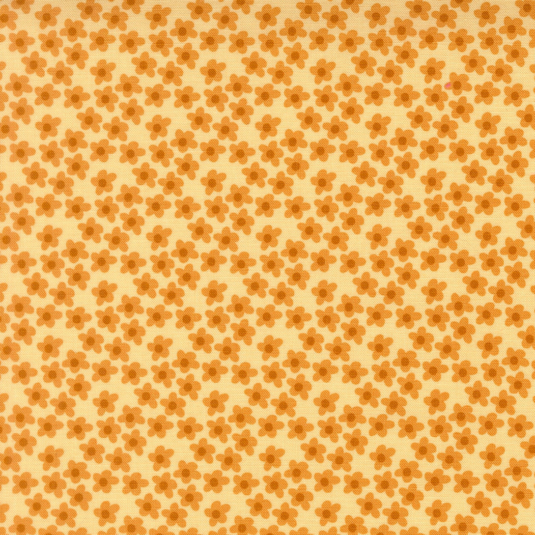 Small orange flowers on soft yellow Moda's Toast and Jam by Elizabeth Hartman cotton quilting fabric, featuring apricot orange and caramel brown.