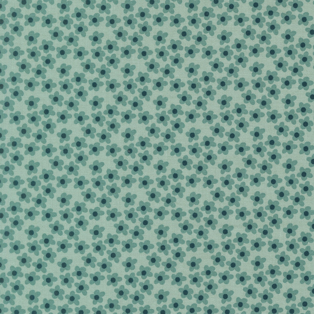 Moda's small stylized five-petal storm blue flowers on mint green cotton quilting fabric from Toast and Jam by Elizabeth Hartman