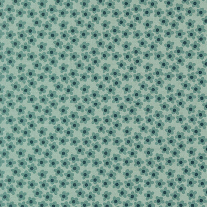 Moda's small stylized five-petal storm blue flowers on mint green cotton quilting fabric from Toast and Jam by Elizabeth Hartman