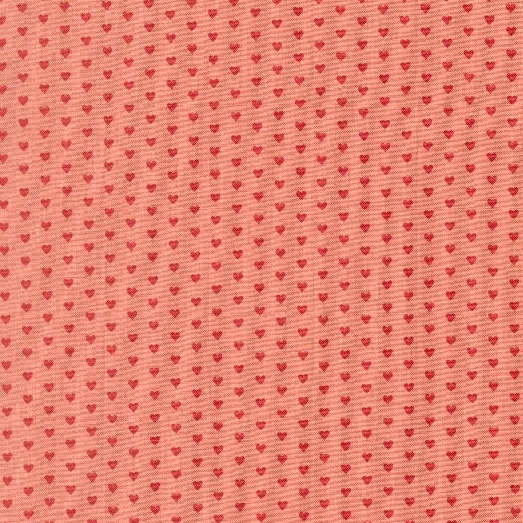 Moda's small red hearts on tea rose pink Toast and Jam by Elizabeth Hartman cotton quilting fabric for Valentine's Day or nursery.