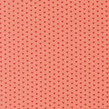 Moda's small red hearts on tea rose pink Toast and Jam by Elizabeth Hartman cotton quilting fabric for Valentine's Day or nursery.